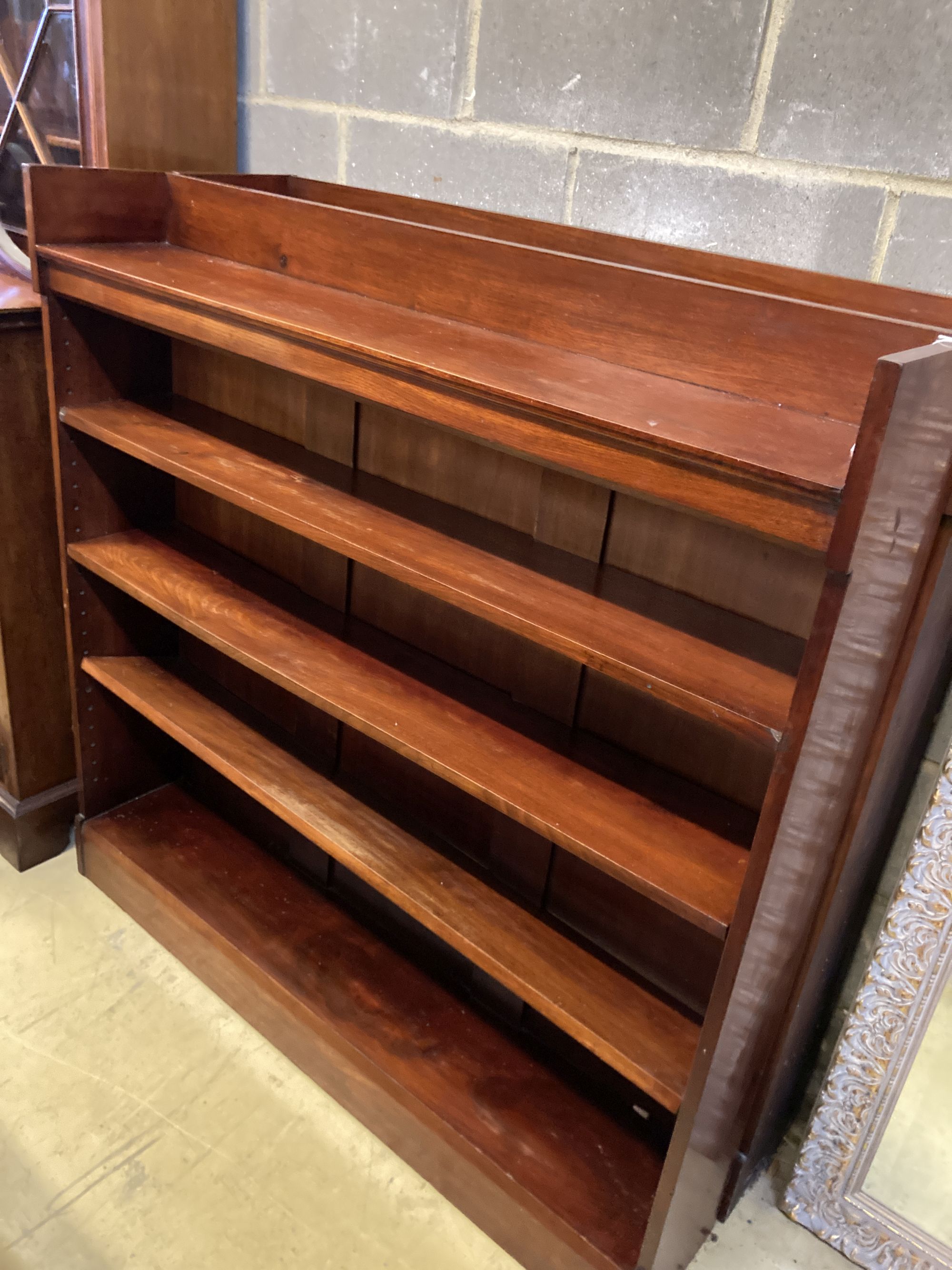 A pair of Victorian mahogany open bookcases, width 127cm, depth 24cm, height 126cm